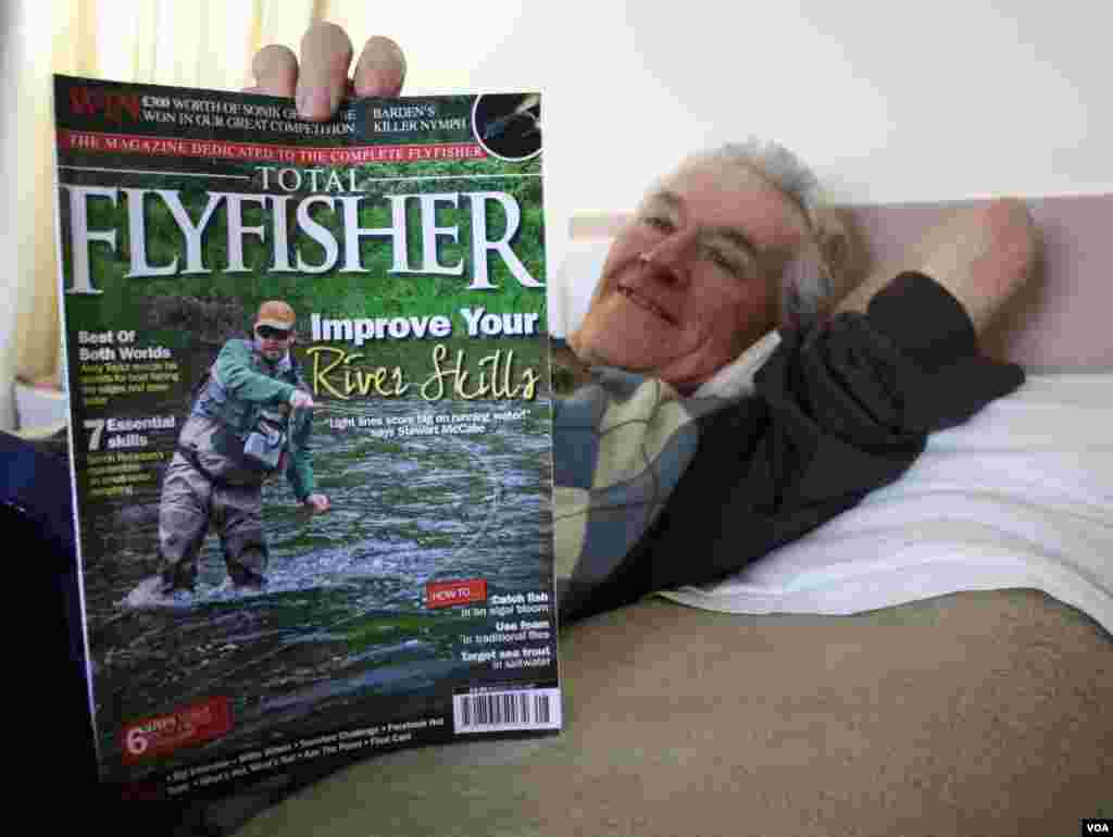 Cunnington reads his favorite sports magazine and remembers when his son was four and came home with two of the largest fish ever caught on the family's farm. (Photo by Darren Taylor)