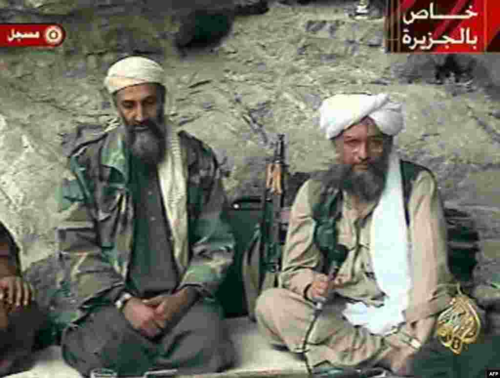 Osama bin Laden, left, with his top lieutenant Egyptian Ayman al-Zawahri, is seen at an undisclosed location in this television image broadcast Sunday, Oct. 7, 2001. Bin Laden praised God for the Sept. 11 terrorist attacks and swore America "will nev