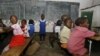 FILE: Abantwana bayafunda esikolo kwele Zimbabwe. AFP PHOTO / Desmond Kwande / AFP PHOTO / DESMOND KWANDE