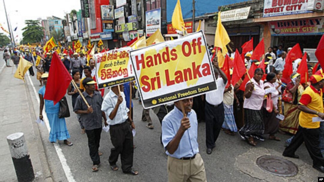 Thousands of flag-waving Sri Lankans used a May Day rally Sunday to protest a UN report on alleged crimes committed during the country's civil war, Colombo, May 1, 2011