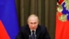 FILE - Russian President Vladimir Putin meets with officials in Moscow, Russia, Dec. 3, 2019. This week he signed a law increasing fines and penalties against so-called "foreign agents" working in mass media.