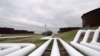 FILE PHOTO: Pipelines run to Enbridge Inc.'s crude oil storage tanks at their tank farm in Cushing