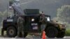 U.S. soldiers serving in the NATO-led peacekeeping force KFOR guard a checkpoint on a road near the village of Leposavic, northern Kosovo, Aug. 18, 2022. (AP Photo/Bojan Slavkovic, File)