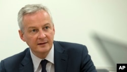 FILE - French Finance Minister Bruno Le Maire speaks during a news conference on the side lines of the World Bank/IMF Annual Meetings in Washington, Oct. 18, 2019.