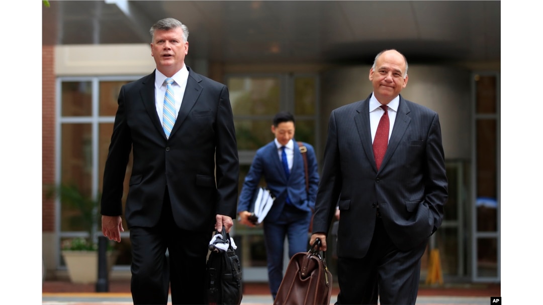 Kevin Downing, left, and Thomas Zehnle, attorneys for Paul Manafort, walk to the Alexandria Federal Courthouse in Alexandria, Va., Aug. 3, 2018, on day four of the former Donald Trump campaign chairman's tax evasion and bank fraud trial.