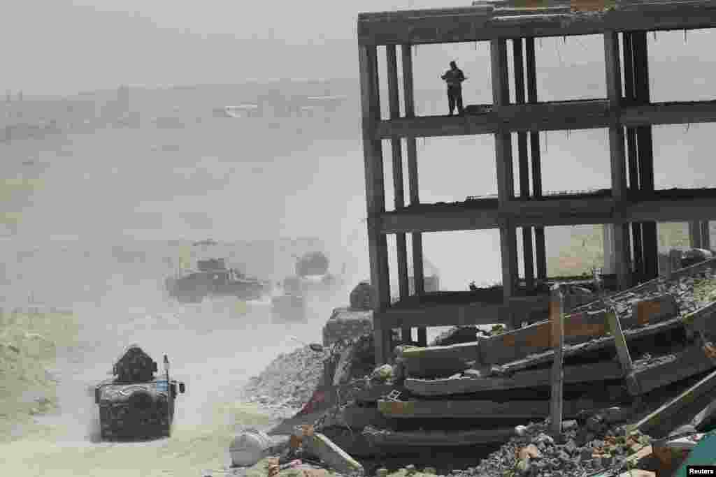 Vehicles of the Iraqi security forces are seen on the outskirts of Fallujah.