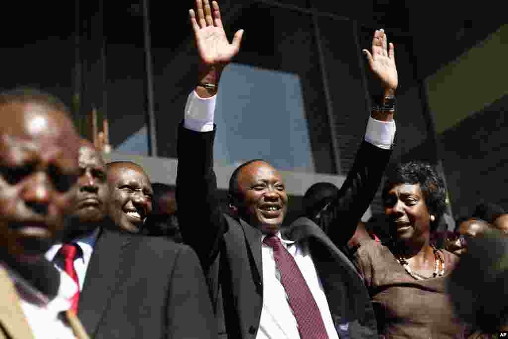 Kenyan president-elect Uhuru Kenyatta waves at supporters after winning the elections in Nairobi, Mar. 9, 2013.