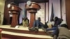Journalists are seen on the podium following sounds of gunshots before a news conference by South Sudan President Salva Kiir, First Vice President Riek Machar and other officials inside the Presidential State House in Juba, July 8, 2016.