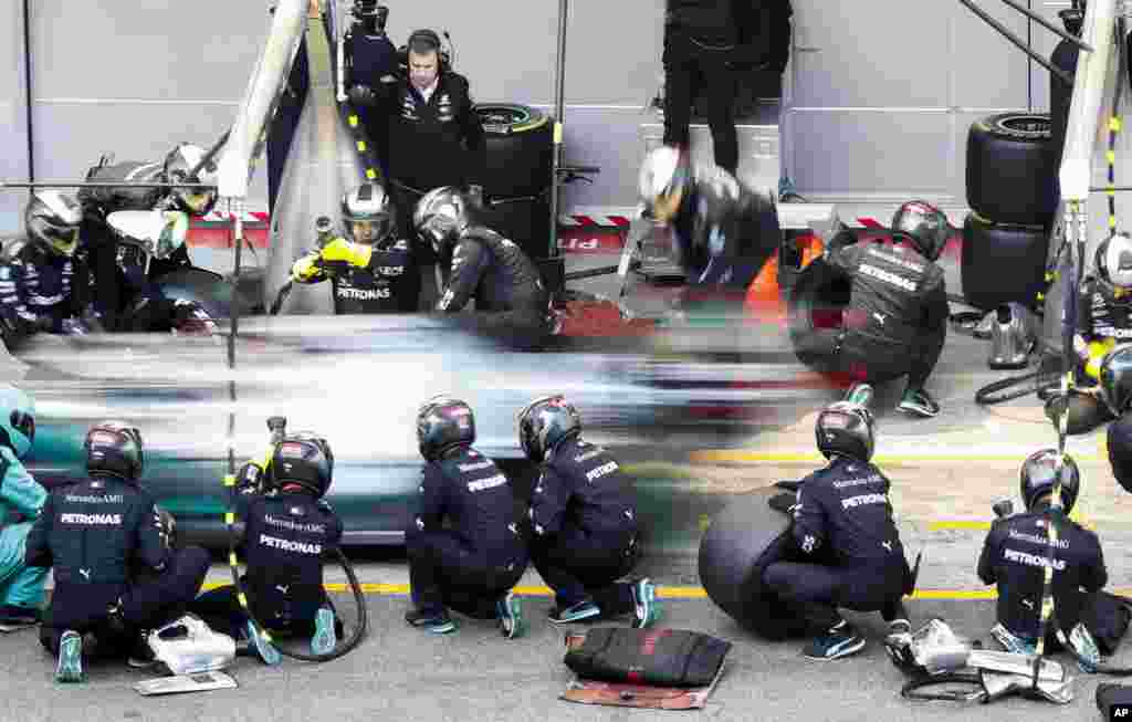 Mercedes-AMG Petronas' Lewis Hamilton makes a pit stop during a Formula One pre-season testing session at the Barcelona Catalunya racetrack in Montmelo, outside Barcelona, Spain, Feb. 19, 2020.