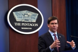 FILE - Defense Secretary Mark Esper speaks during a news conference at the Pentagon in Washington, Dec. 20, 2019.