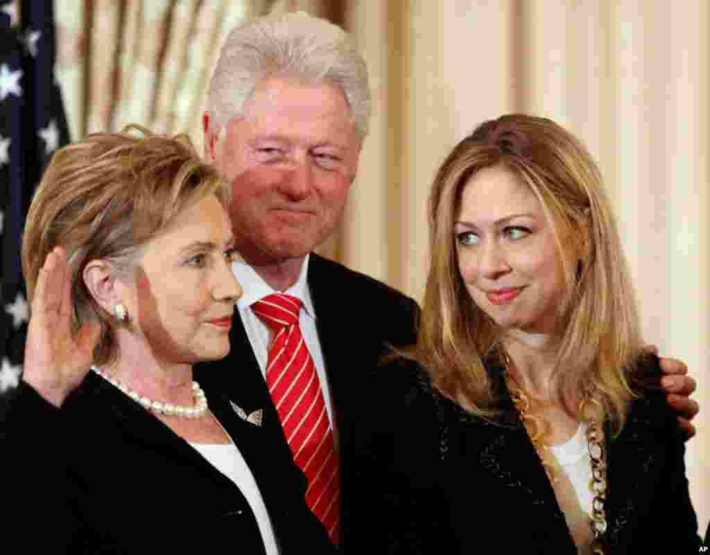Former President Bill Clinton and daughter Chelsea during the ceremonial swearing-in for Hillary Clinton, February 2, 2009, at the State Department in Washington.