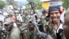 Congolese Revolution Army [M23] rebels sit on a truck soon after capturing the city from the government army, as they patrol a street in Goma in the eastern Democratic Republic of Congo, November 20, 2012.