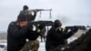 Ukrainian servicemen fight at their position near Lysychansk, in the Luhansk region, Jan. 29, 2015.