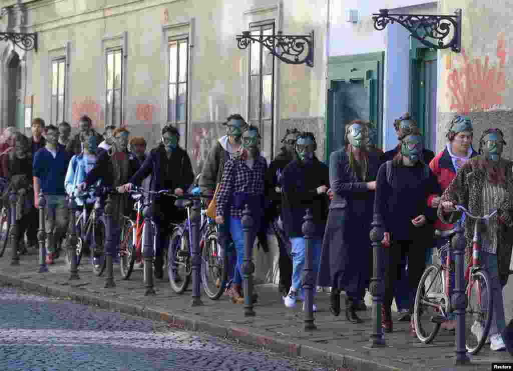 Activists from the Youth for Climate Justice movement protest during the last Valentine's Day performance against the national energy and climate plan in Ljubljana, Slovenia.