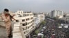 FILE - In this Nov. 25, 2019, photo, an Iranian soldier stands guard overlooking a pro-government rally organized by authorities in Tehran, Iran, denouncing violent protests over a government-imposed fuel price hike.