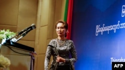 Aung San Suu Kyi takes the stage May 7 at a forum for National Reconciliation for Peace in Myanmar
