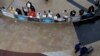 Hotel and taxi representative stand in front of the arrival gate at O.R. Tambo International airport in Johannesburg Aug. 25, 2014.