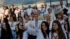 People wearing the traditional Ukrainian garment known as the vyshyvanka at a gathering in the center of Kyiv, Ukraine, on Thursday, May 21, 2015. (AP Photo/Sergei Chuzavkov)