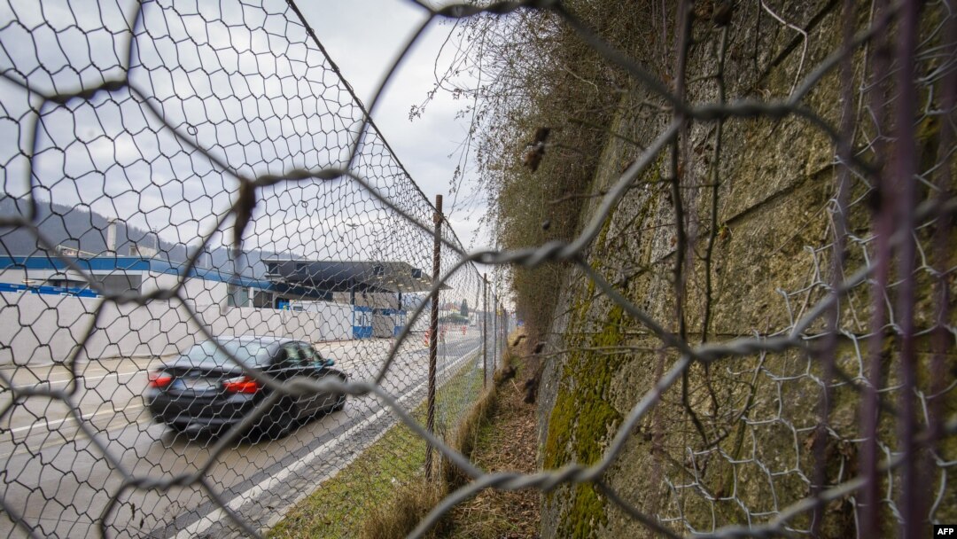 FILE - A border crossing and a fence are seen in in the village of Spielfeld, Austria, at the Austria-Slovenia border, Feb. 21, 2017. 
