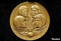 FILE - The Congressional Gold Medal to recognize the American Fighter Aces' service to the United States throughout the history of aviation warfare on display, in Washington D.C., May 20, 2015.