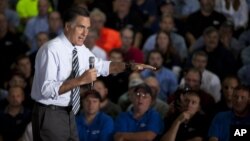 Republican presidential candidate, former Massachusetts Gov. Mitt Romney gestures during a town hall meeting at Ariel Corporation in Mt. Vernon, Ohio, October 10, 2012.