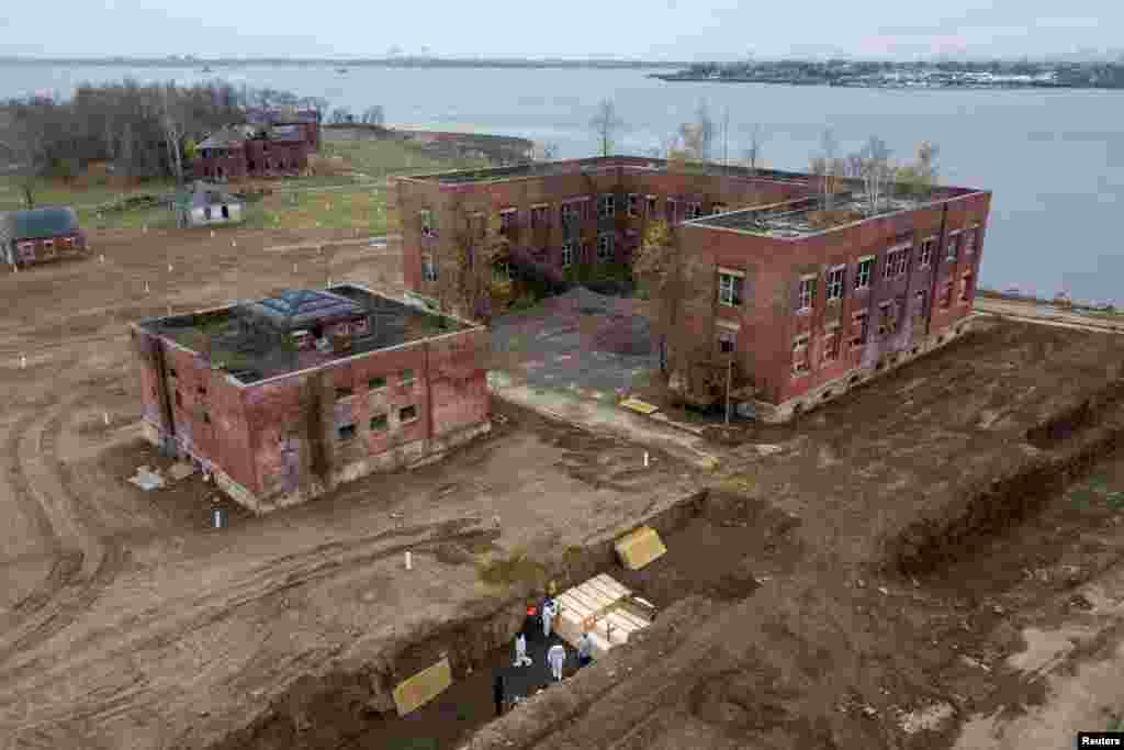 Drone pictures show bodies being buried on New York's Hart Island where the department of corrections is dealing with more burials overall, amid the coronavirus disease (COVID-19) outbreak in New York City.