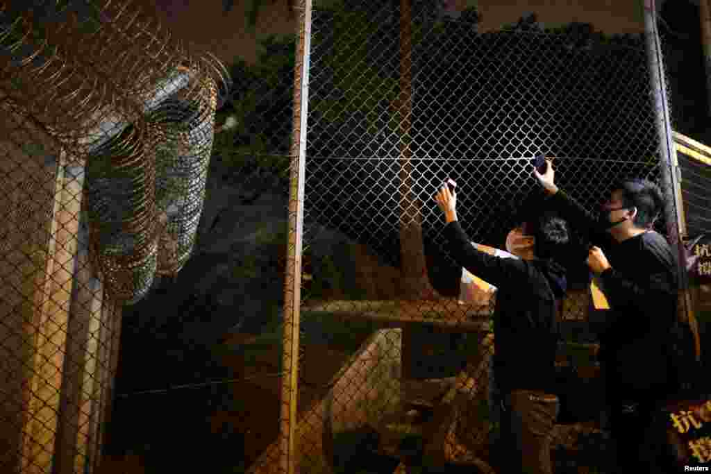 Hong Kong protesters gather outside a detention center in Lai Chi Kok to demand the release of protesters, in Hong Kong, China.