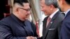 In this photo released by the Ministry of Communications and Information of Singapore, North Korean leader Kim Jong Un is greeted by Singapore Minister for Foreign Affairs Dr Vivian Balakrishnan at the Changi International Airport, June 10, 2018.
