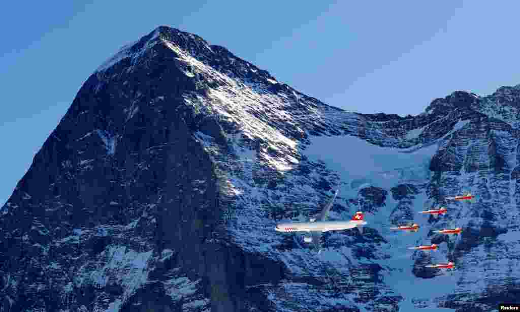 A Swiss Airbus A321 and Patrouille Suisse fly before men's downhill training at the FIS Alpine Ski World Cup in Wengen, Switzerland.