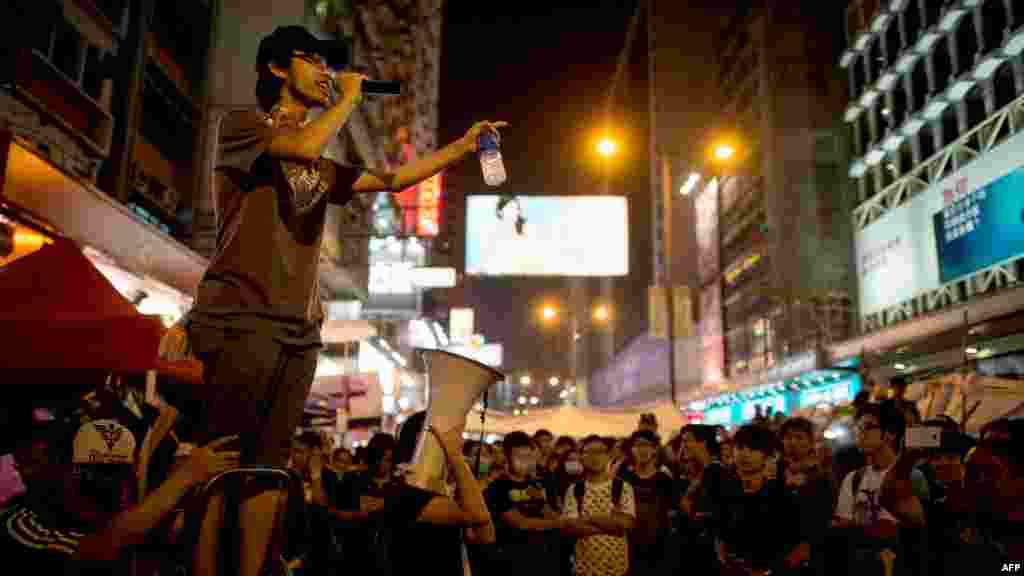 A pro-democracy protester talks on a loudspeaker to there gathered in the Mong Kok district of Hong Kong, Oct. 5, 2014.