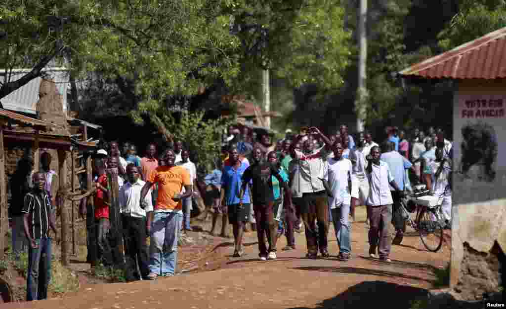 Demonstrators chant slogans in Kenya's western town of Kisumu, 350km (218 miles) from the capital Nairobi as tension arises after Uhuru Kenyatta was declared winner of presidential election, Mar. 9, 2013.