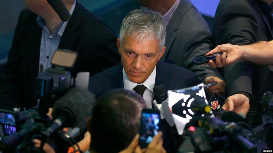 Swiss Attorney General Michael Lauber, center, speaks to media following a news conference in Bern, Switzerland, June 17, 2015. 
