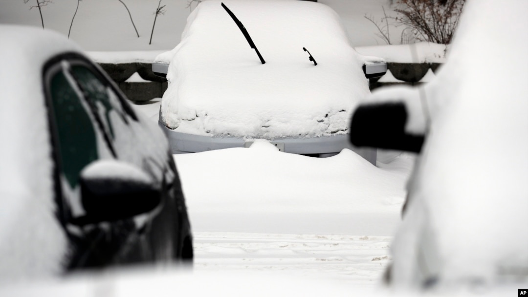 Cars are covered by snow, following a winter storm, Jan. 28, 2019, in Wheeling, Illinois, as the entire region braces itself for record-low subzero temperatures. 