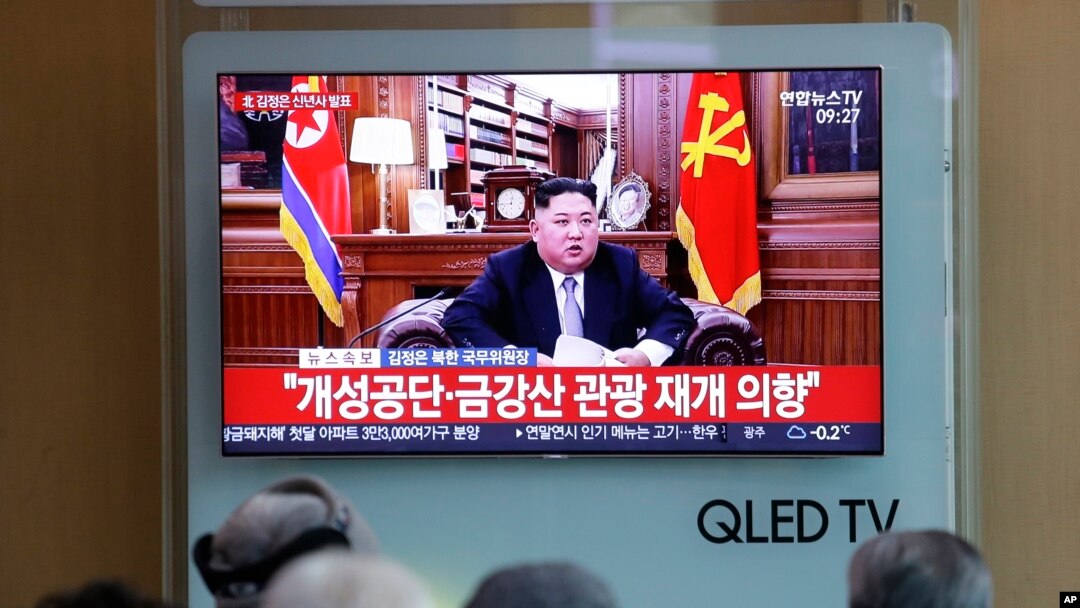 People watch a TV news on a screen showing North Korean leader Kim Jong Un delivering a New Year's speech, at Seoul Railway Station in Seoul, South Korea, Jan. 1, 2019.
