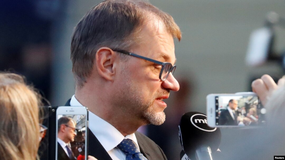 FILE - Finland's Prime Minister Juha Sipila talks to the media as he arrives for an informal meeting of European Union leaders, in Salzburg, Austria, Sept. 19, 2018.