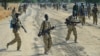 Sudan People's Liberation Army (SPLA) soldiers patrol a road in Mathiang near Bor, Jan. 31, 2014. 