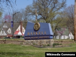 Sign at the entrance of Haskell Indian Nations University, a public tribal land-grant university in Lawrence, Kansas, founded in 1884.