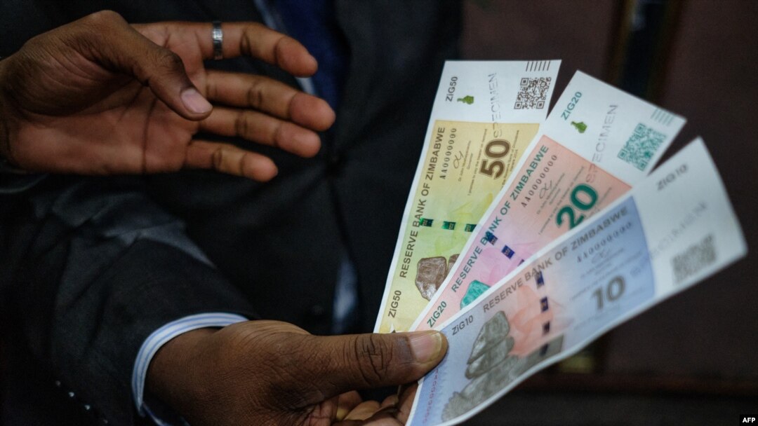 Zimbabwe Reserve Bank Governer John Mushayavanhu presents his monetary policy statement during which he announced the launch by the central bank of the ZiG (Zimbabwe Gold) a "structured currency" in Harare, April 5 2024 as the new money is an attempt to t