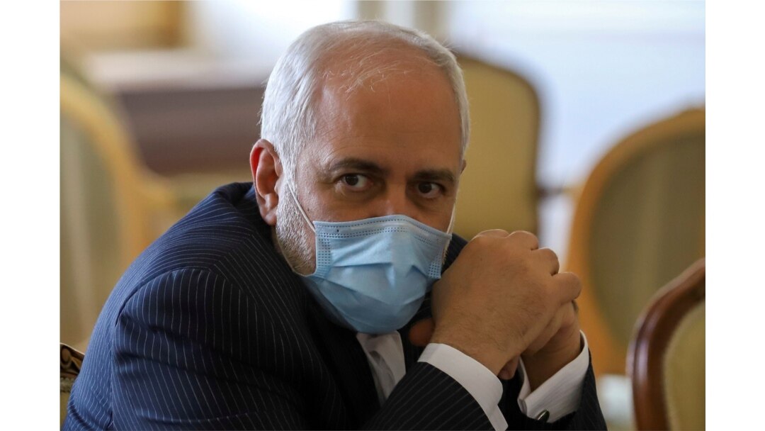 FILE - Iran's Foreign Minister Mohammad Javad Zarif looks on during a meeting with International Atomic Energy Agency (IAEA) Director-General Rafael Grossi in Tehran, Feb. 21, 2021.