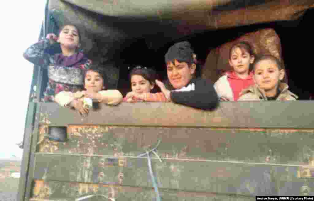 Most of the refugees coming into Jordan from the east are children. These have just been loaded on a Jordanian Border Patrol truck to be moved to safety.