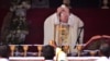 FILE - Pope Francis prepares for Holy Communion during mass at Colombo's seafront Galle Face Green, in Sri Lanka, Jan. 14, 2015.