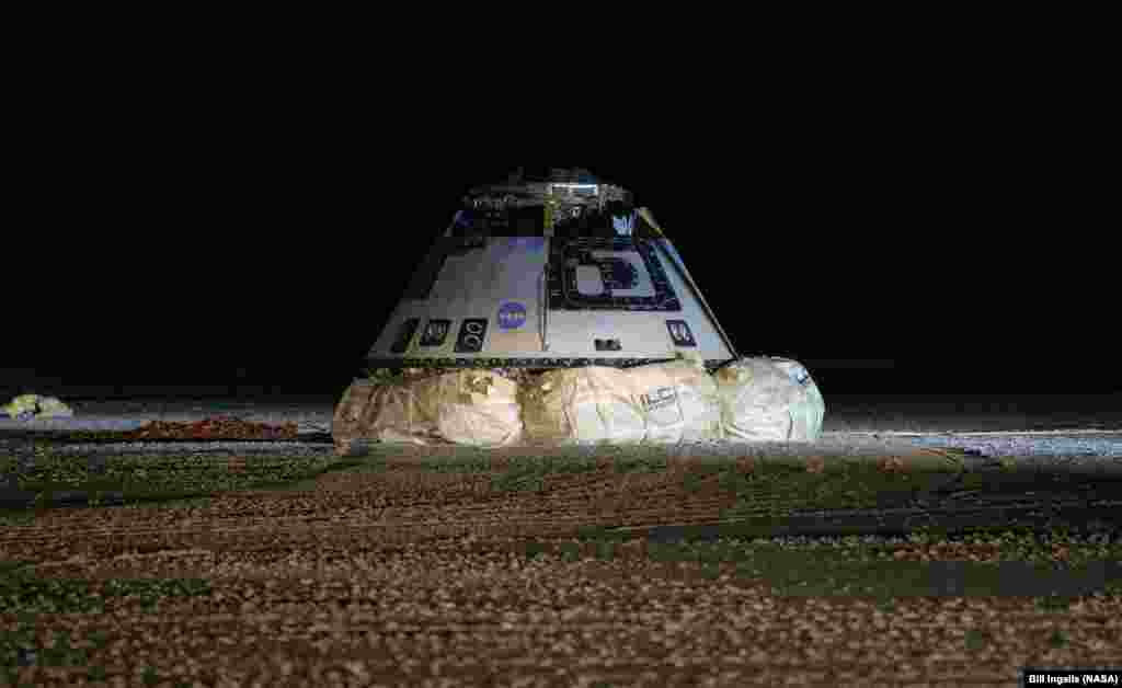 The Boeing CST-100 Starliner spacecraft is seen after it landed in White Sands, New Mexico. The landing completes an abbreviated Orbital Flight Test for the company that still meets several mission objectives for NASA’s Commercial Crew program.
