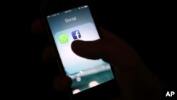 FILE - The Facebook app icon is shown on an iPhone in New York.