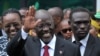 FILE - Tanzania's President elect John Magufuli salutes members of the ruling Chama Cha Mapinduzi Party (CCM) at the party's sub-head office on Lumumba road in Dar es Salaam.