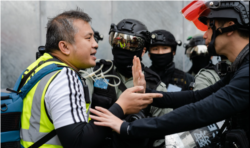 香港記者協會主席陳朗昇在2019年“反送中”抗爭中進行採訪活動。 （陳朗昇授權使用）