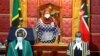 FILE - Tanzanian President Samia Suluhu Hassan (C) arrives to address a joint Parliament session of Kenyan Members of Parliament and Senators in Nairobi, Kenya, May 5, 2021. 