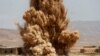 FILE - Members of the Sinjar Resistance Units (YBS), a militia affiliated with the Kurdistan Workers' Party (PKK), detonate improvised explosive devices captured from Islamic State fighters near village of Umm al-Dhiban, northern Iraq, April 30, 2016.