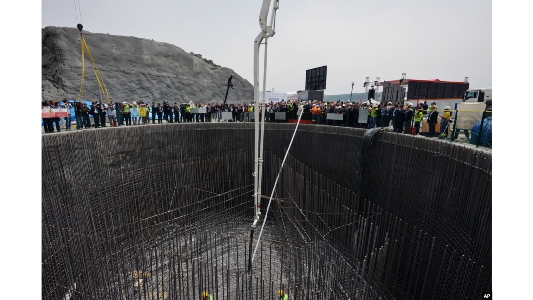 FILE - Turkish leaders and their wives attend a groundbreaking ceremony for the construction of a third bridge over the Bosporus Strait connecting the Asian and European sides of Istanbul, Turkey, May 29, 2013.