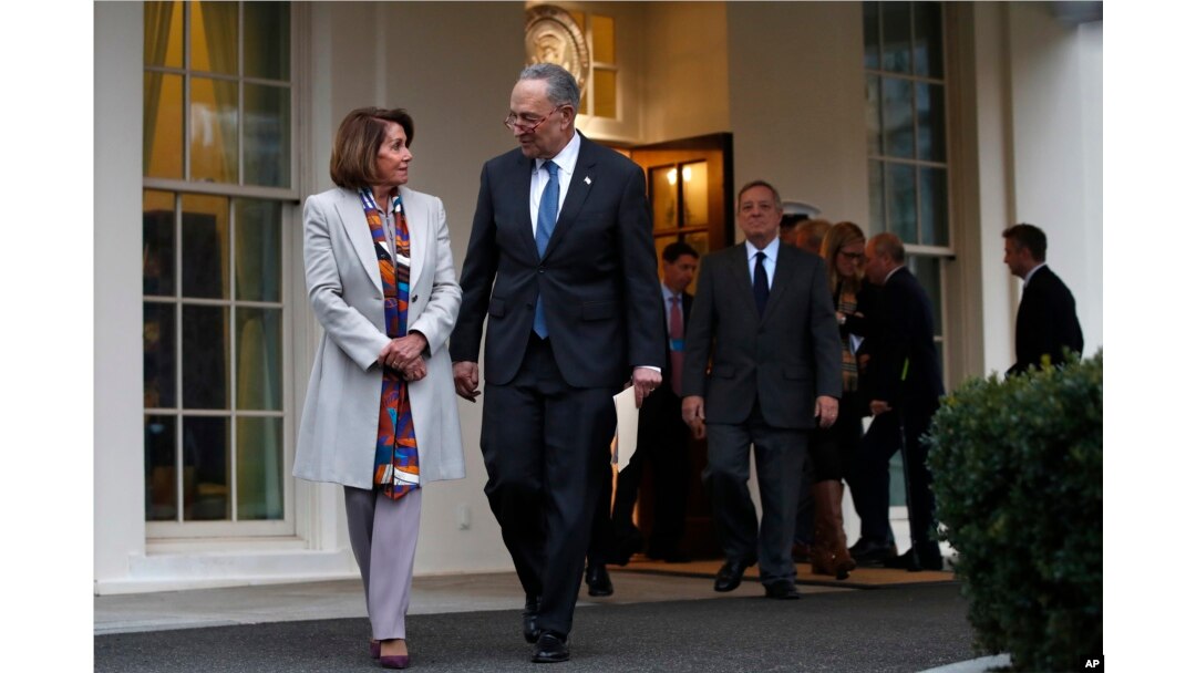 House Democratic leader Nancy Pelosi of California, left, walks with Senate Minority Leader Chuck Schumer, D-N.Y., as Democratic leaders including Sen. Dick Durbin, D-Ill., at right, arrive to speak to the media after meeting with President Donald Trump, Jan. 4, 2019.