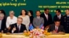 FILE - Australian Immigration Minister Scott Morrison, front left, signs a document together with Cambodian Interior Minister Sar Kheng, front right, during a ceremony for a controversial deal to resettle refugees in Phnom Penh, Cambodia, Sept. 26, 2014